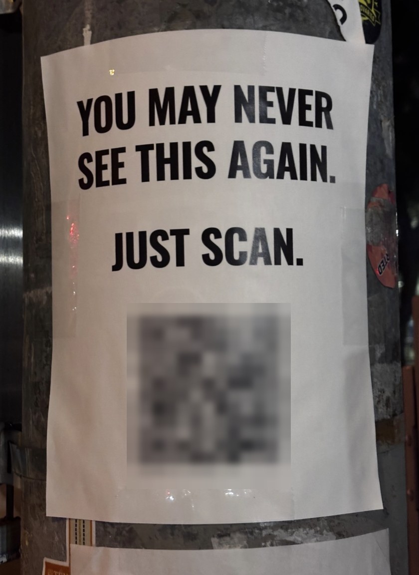 The poster on a pole: "YOU MAY NEVER SEE THIS AGAIN. JUST SCAN." The code is blurred on purpose